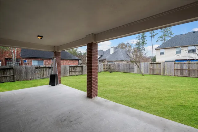 a view of a yard with porch and a small cabin