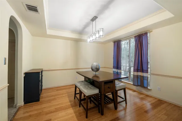 a view of a dining room with furniture and window