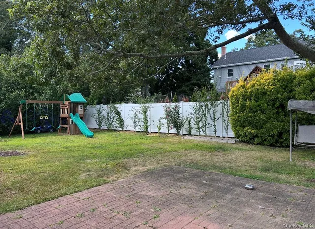 a view of a backyard with a garden and plants
