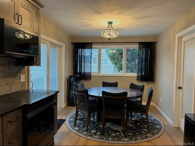 a view of a dining room with furniture window and outside view
