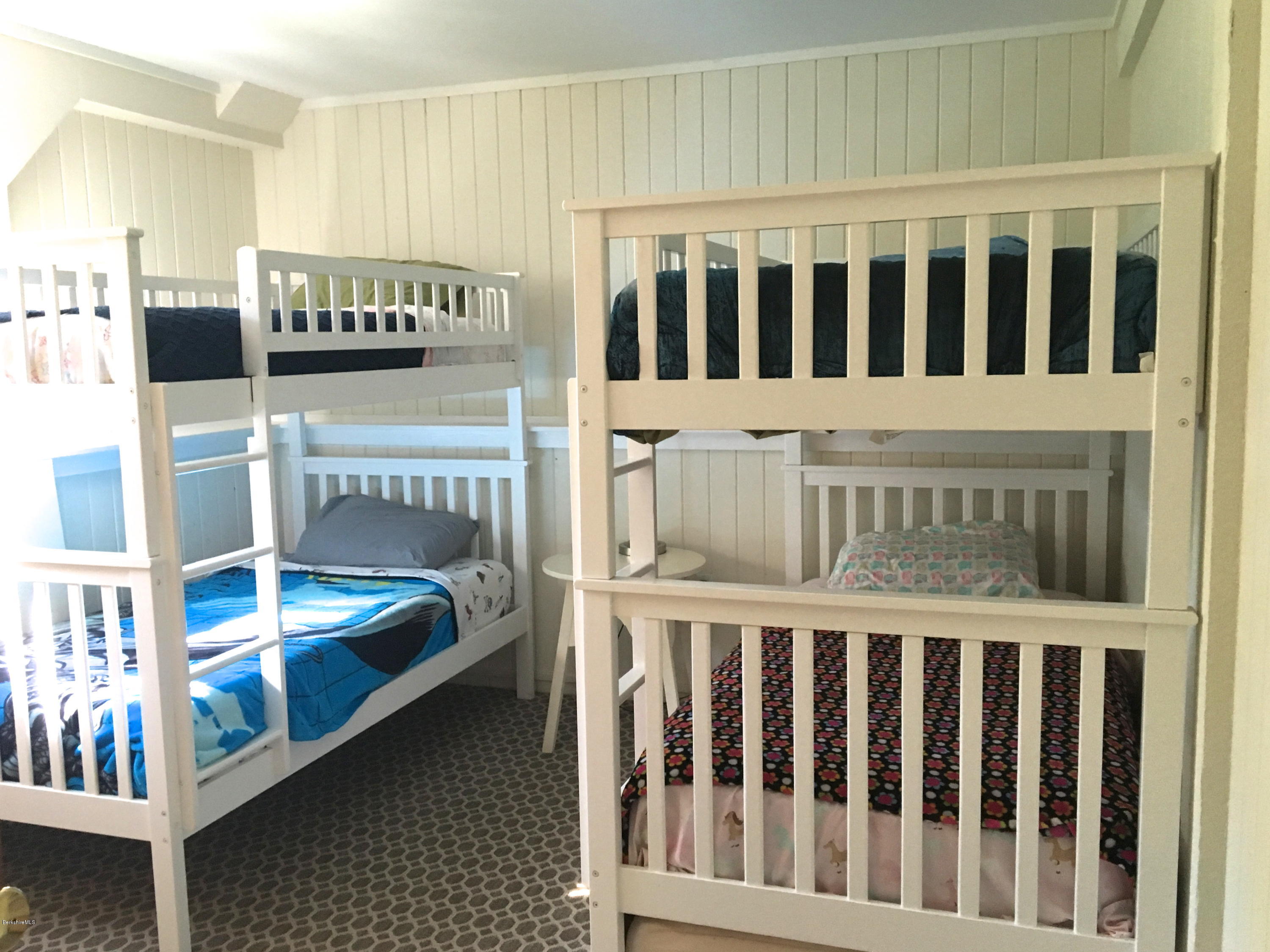 10 Stump Road Sandisfield, MA 01255 - Photo 14 of 30 a bedroom with two beds and a baby crib