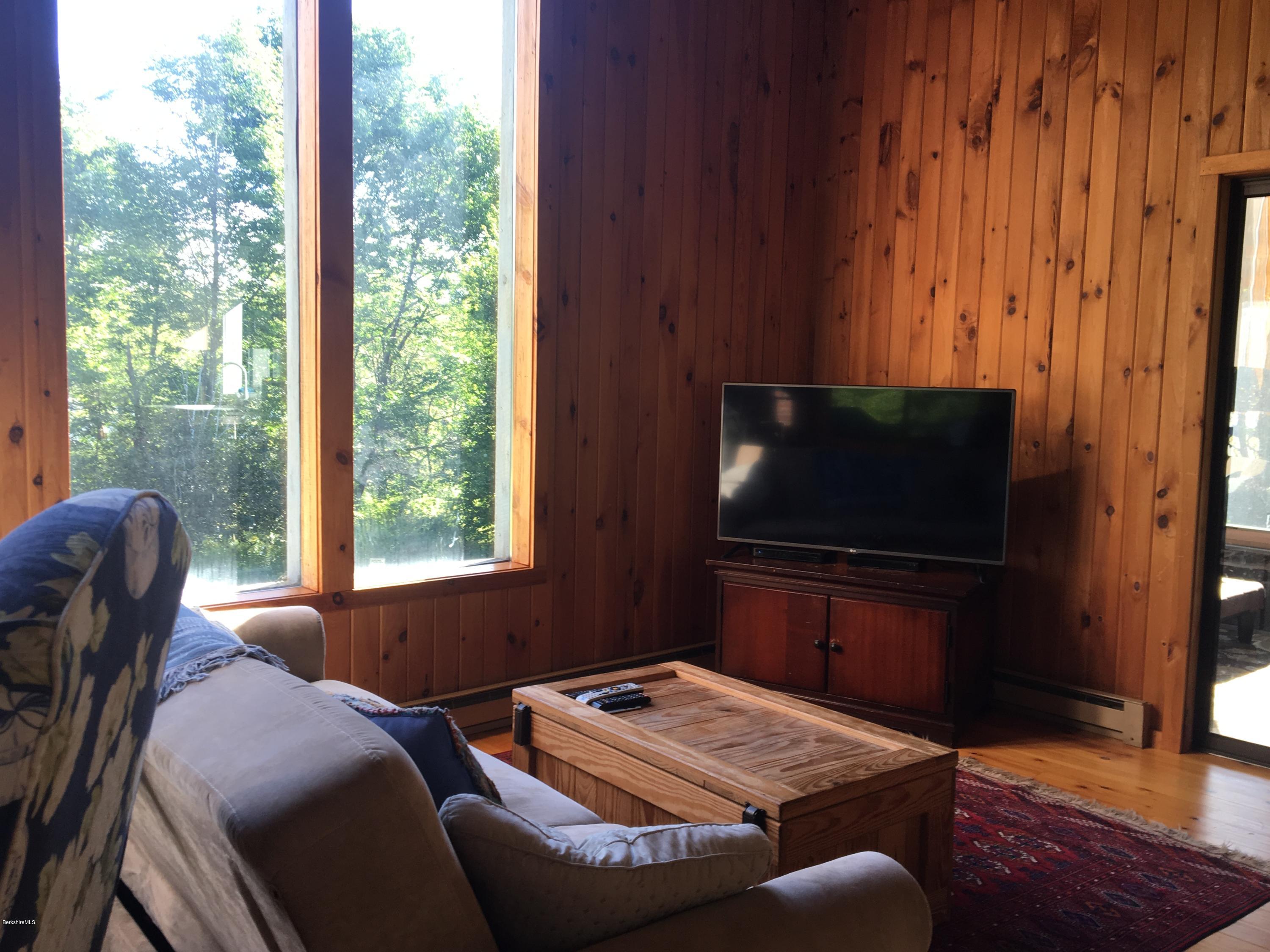 10 Stump Road Sandisfield, MA 01255 - Photo 8 of 30 a living room with furniture and a flat screen tv