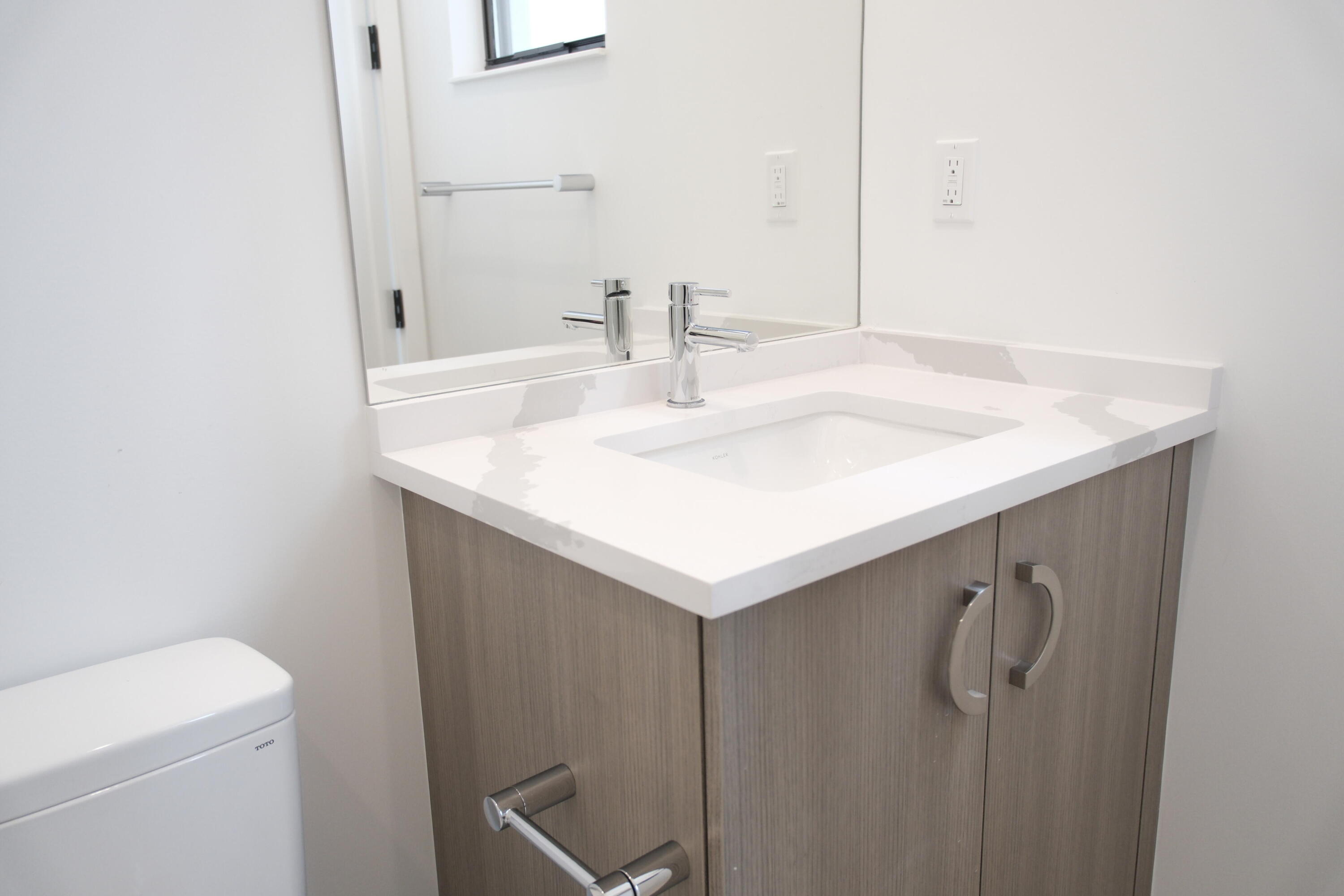 9516 Riverside Pk Drive Boca Raton, FL 33434 - Photo 11 of 24 a bathroom with a sink and a mirror