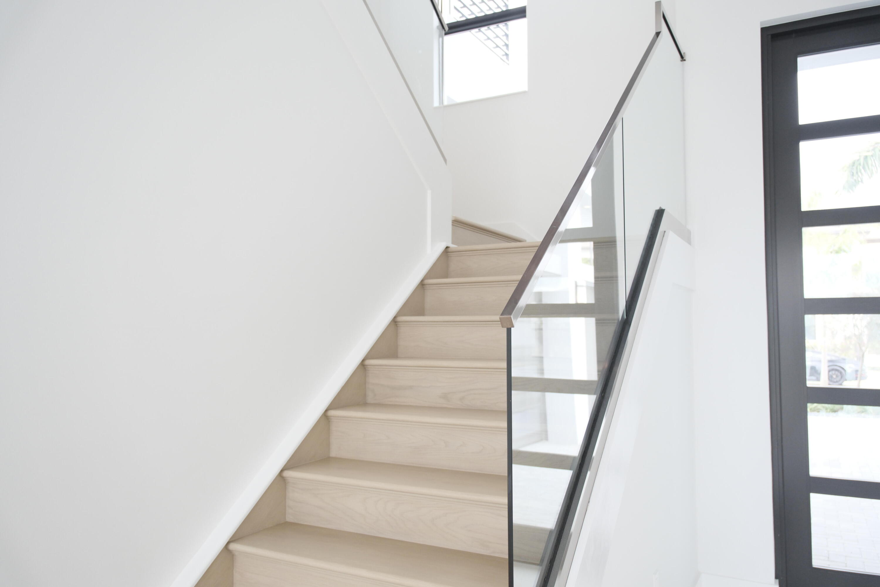 9516 Riverside Pk Drive Boca Raton, FL 33434 - Photo 12 of 24 a view of staircase with wooden floor and white walls