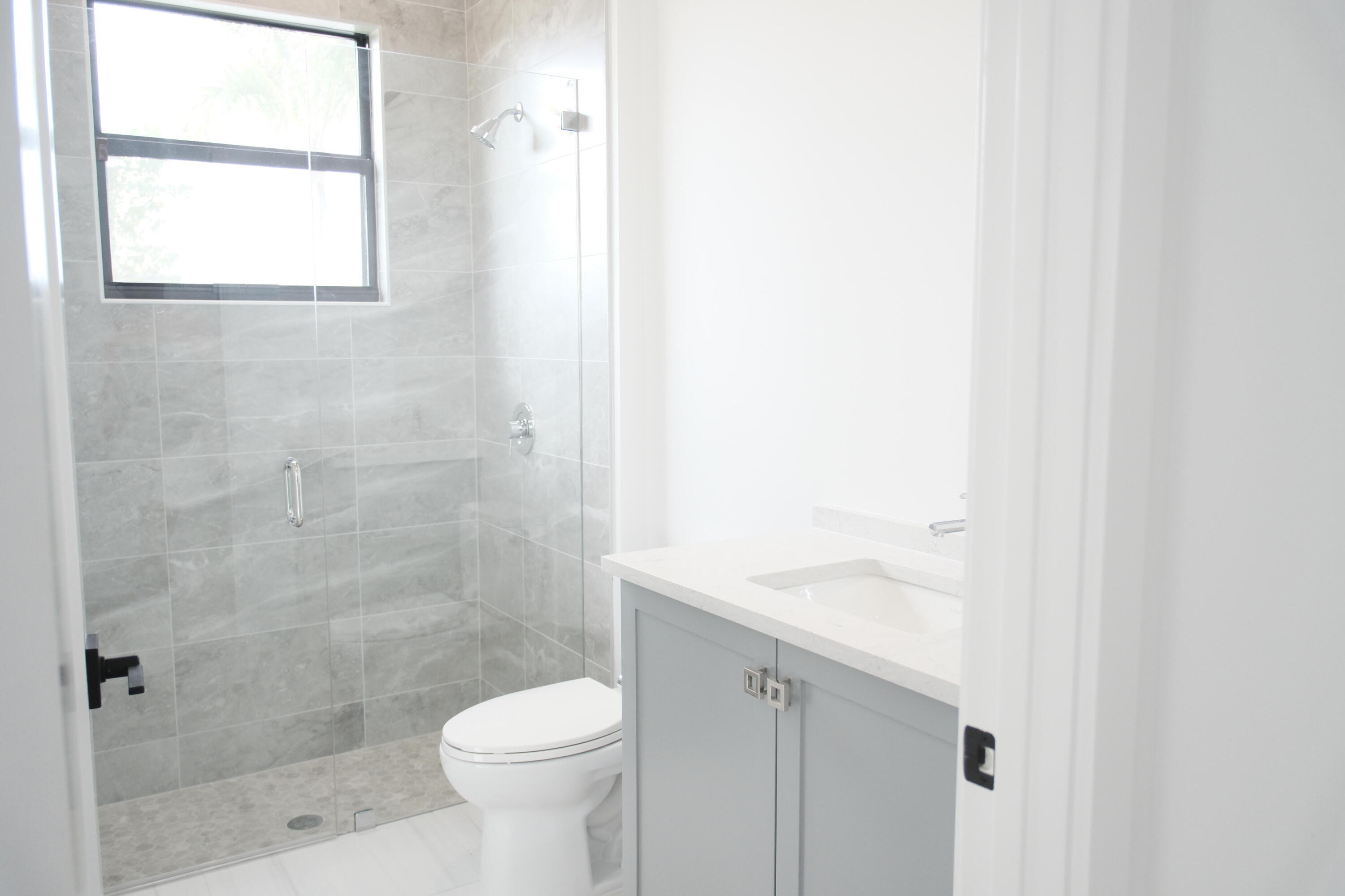 9516 Riverside Pk Drive Boca Raton, FL 33434 - Photo 16 of 24 a bathroom with a sink and a toilet