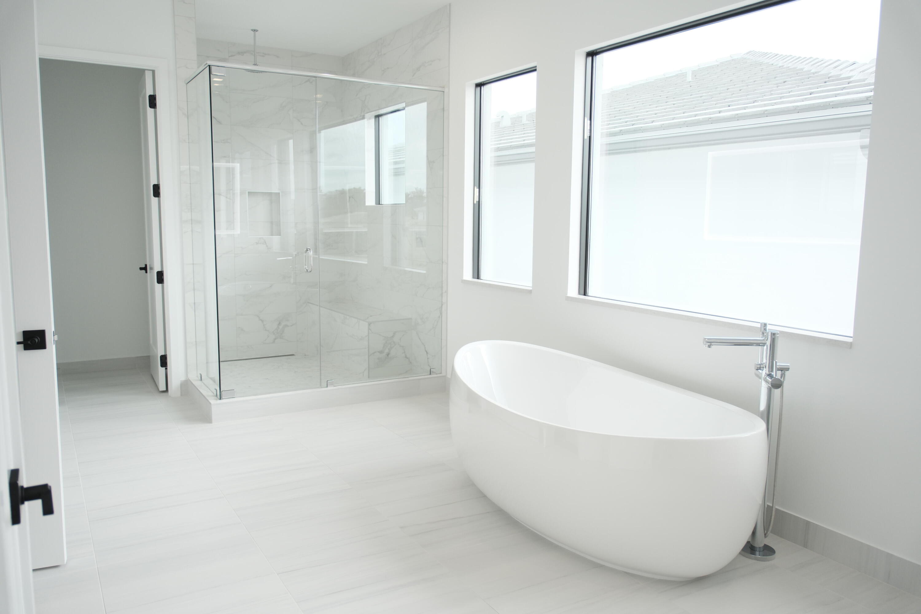 9516 Riverside Pk Drive Boca Raton, FL 33434 - Photo 18 of 24 a white bath tub sitting next to a shower