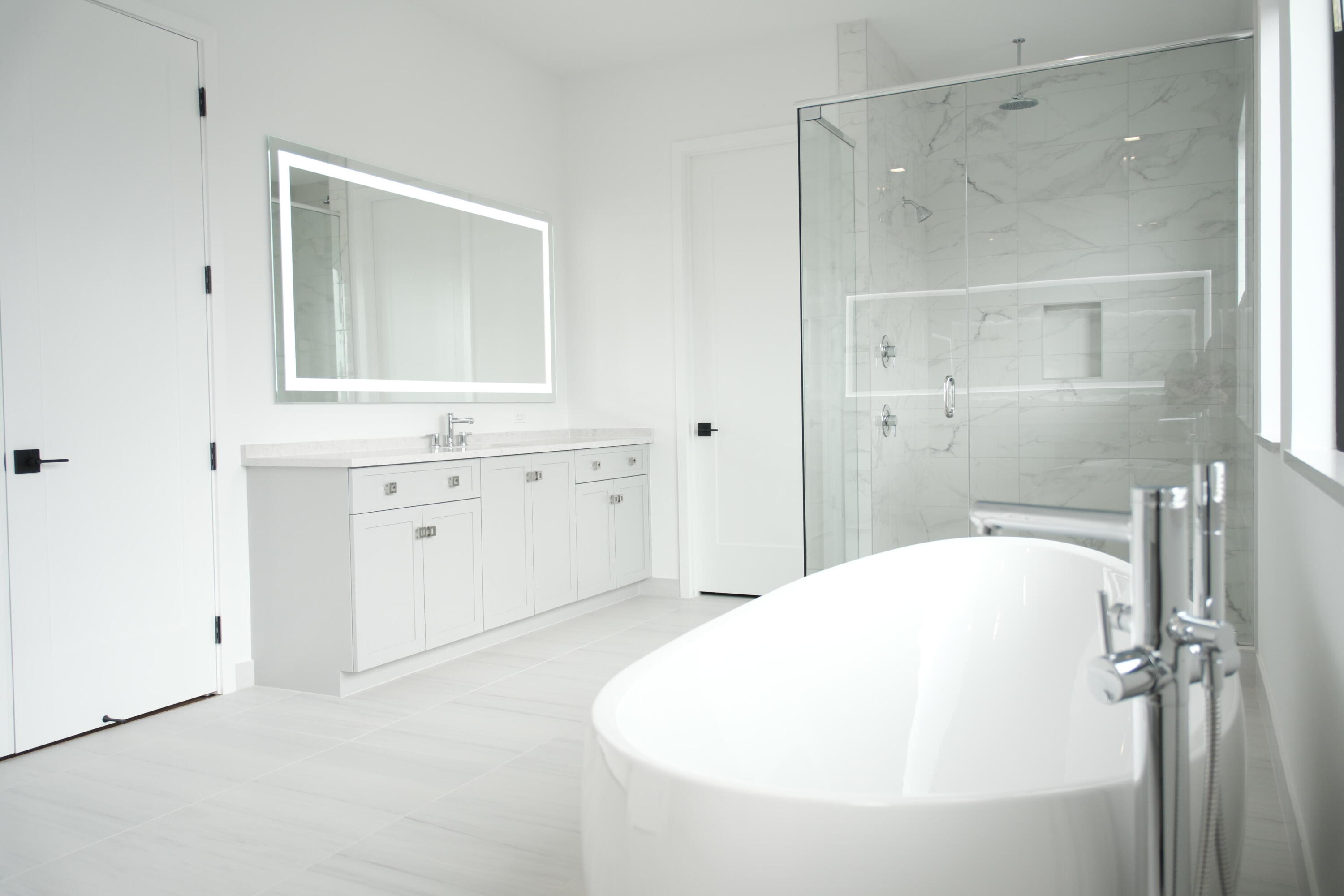 9516 Riverside Pk Drive Boca Raton, FL 33434 - Photo 19 of 24 a bathroom with a bathtub and a shower