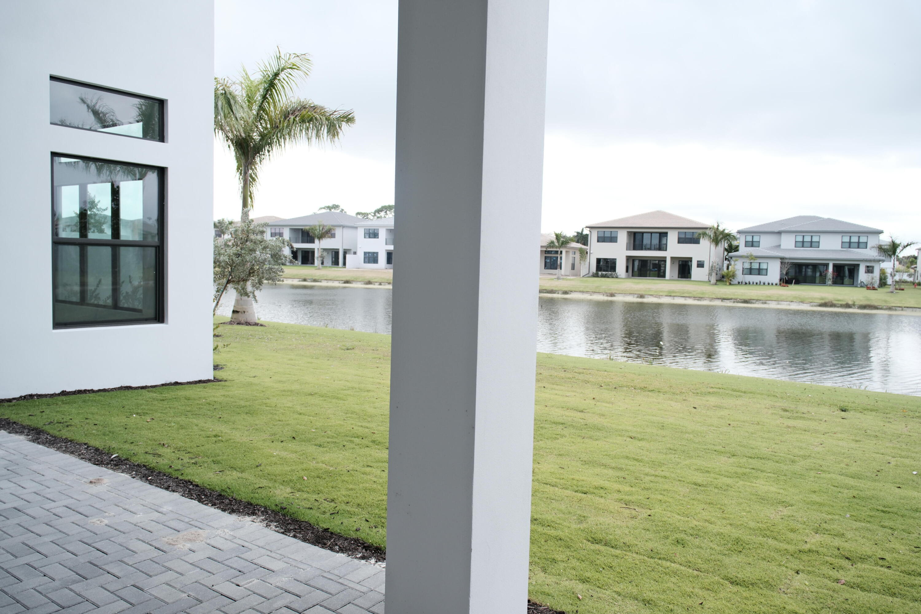 9516 Riverside Pk Drive Boca Raton, FL 33434 - Photo 23 of 24 a view of a lake with a building in the background