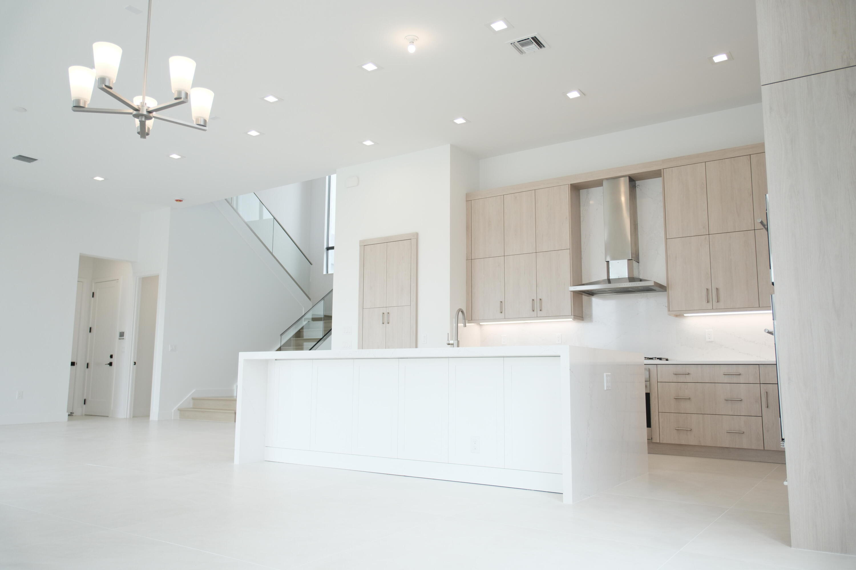 9516 Riverside Pk Drive Boca Raton, FL 33434 - Photo 8 of 24 a living room with furniture and a chandelier