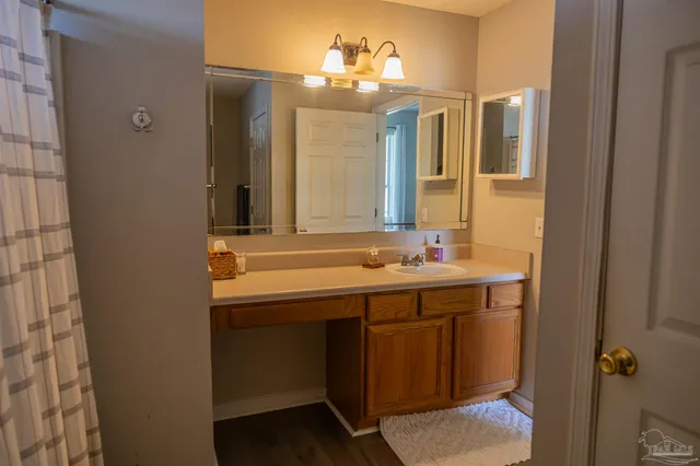 a bathroom with a sink and a mirror