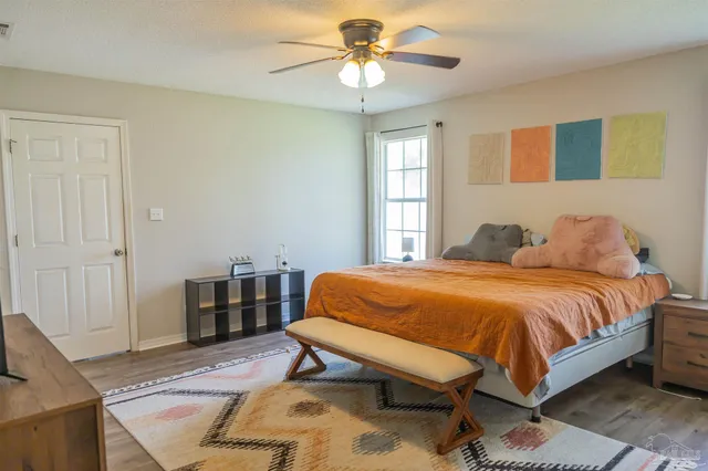 a bedroom with a bed and window