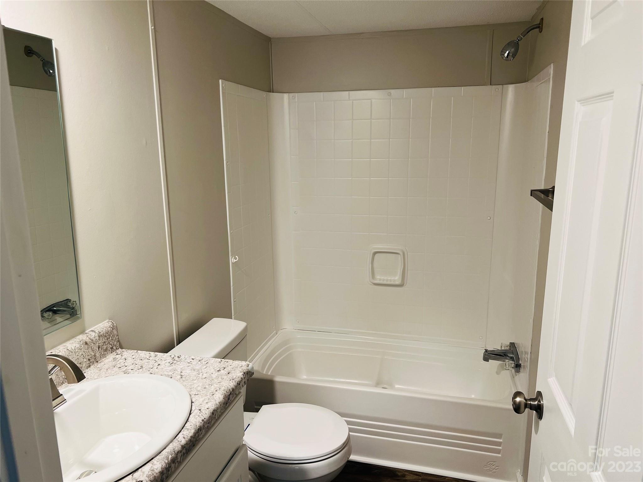 5310 Fallston Road Lawndale, NC 28090 - Photo 15 of 20 a bathroom with a toilet and a tub