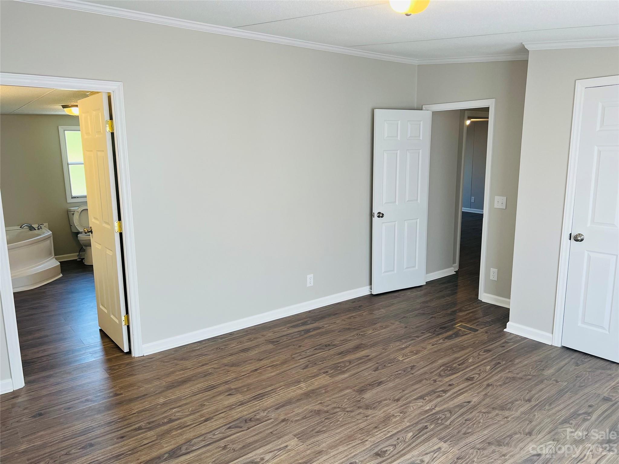 5310 Fallston Road Lawndale, NC 28090 - Photo 18 of 20 a view of a hallway with wooden floor and a livingroom