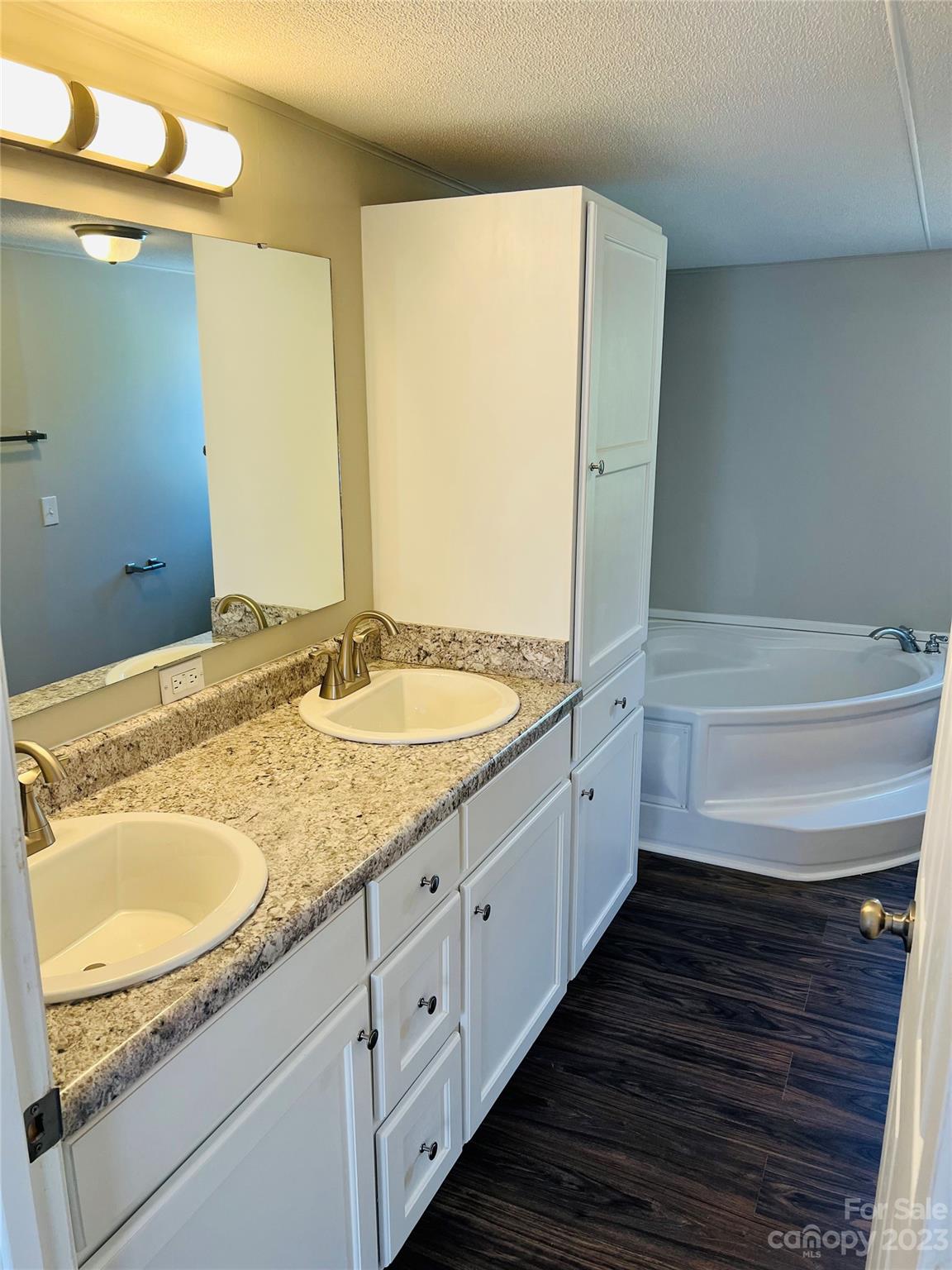 5310 Fallston Road Lawndale, NC 28090 - Photo 19 of 20 a bathroom with a granite countertop sink and a bathtub