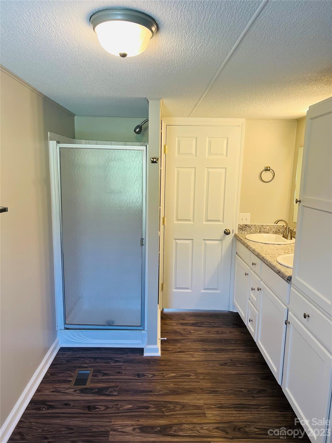 5310 Fallston Road Lawndale, NC 28090 - Photo 20 of 20 a view of a hallway to an empty room with wooden floor and cabinet