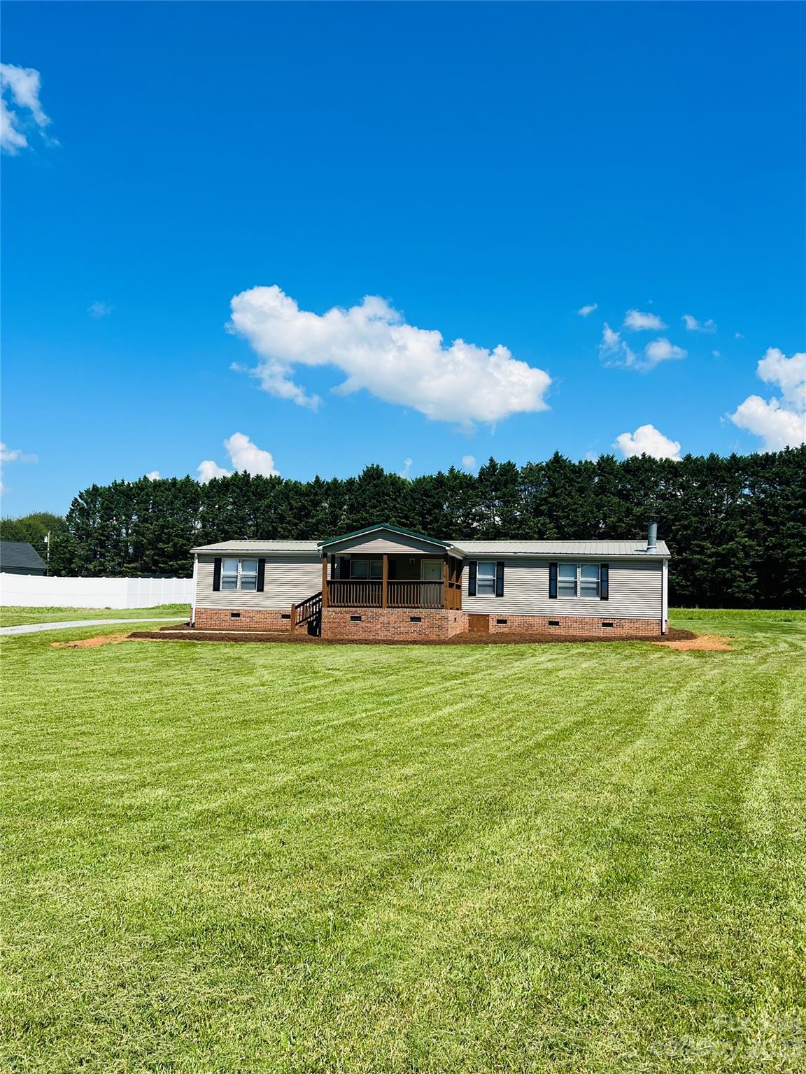 5310 Fallston Road Lawndale, NC 28090 - Photo 3 of 20 a front view of a house with a yard