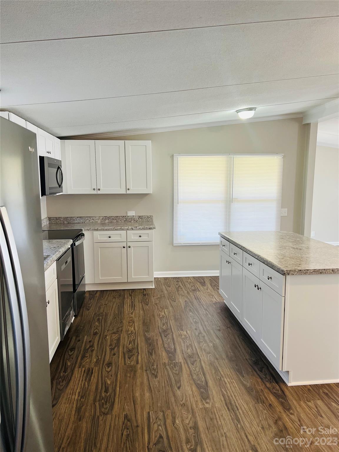 5310 Fallston Road Lawndale, NC 28090 - Photo 7 of 20 a kitchen with wooden floors and white appliances