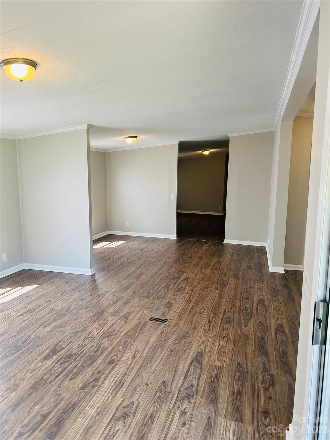 5310 Fallston Road Lawndale, NC 28090 - Photo 10 of 20 a view of an empty room with wooden floor and a window