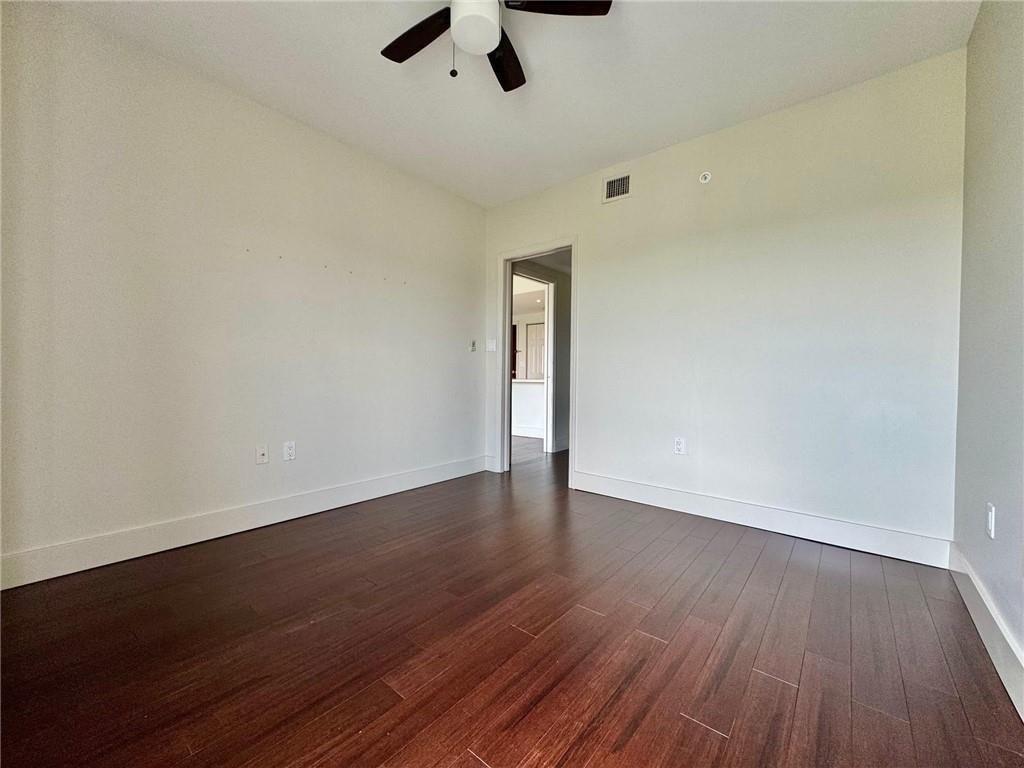 199 14th Street Northeast, Unit 704 Atlanta, GA 30309 - Photo 16 of 34 wooden floor in an empty room