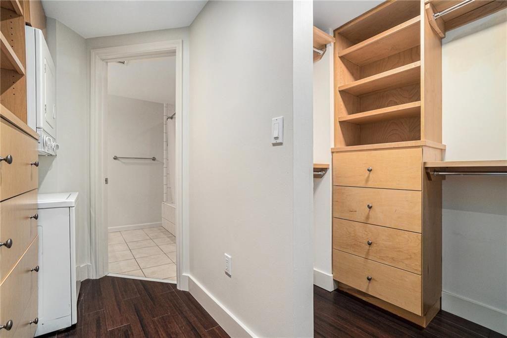 199 14th Street Northeast, Unit 704 Atlanta, GA 30309 - Photo 19 of 34 a view of walk in closet with empty racks