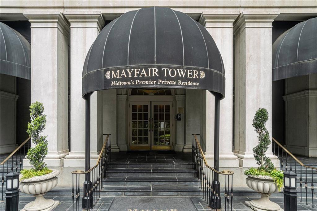 199 14th Street Northeast, Unit 704 Atlanta, GA 30309 - Photo 2 of 34 a front view of a house with a garden