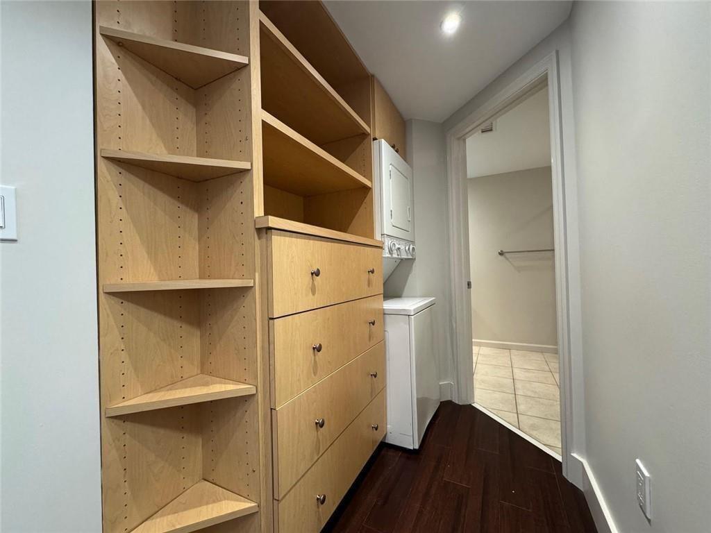 199 14th Street Northeast, Unit 704 Atlanta, GA 30309 - Photo 22 of 34 a hallway with cabinets