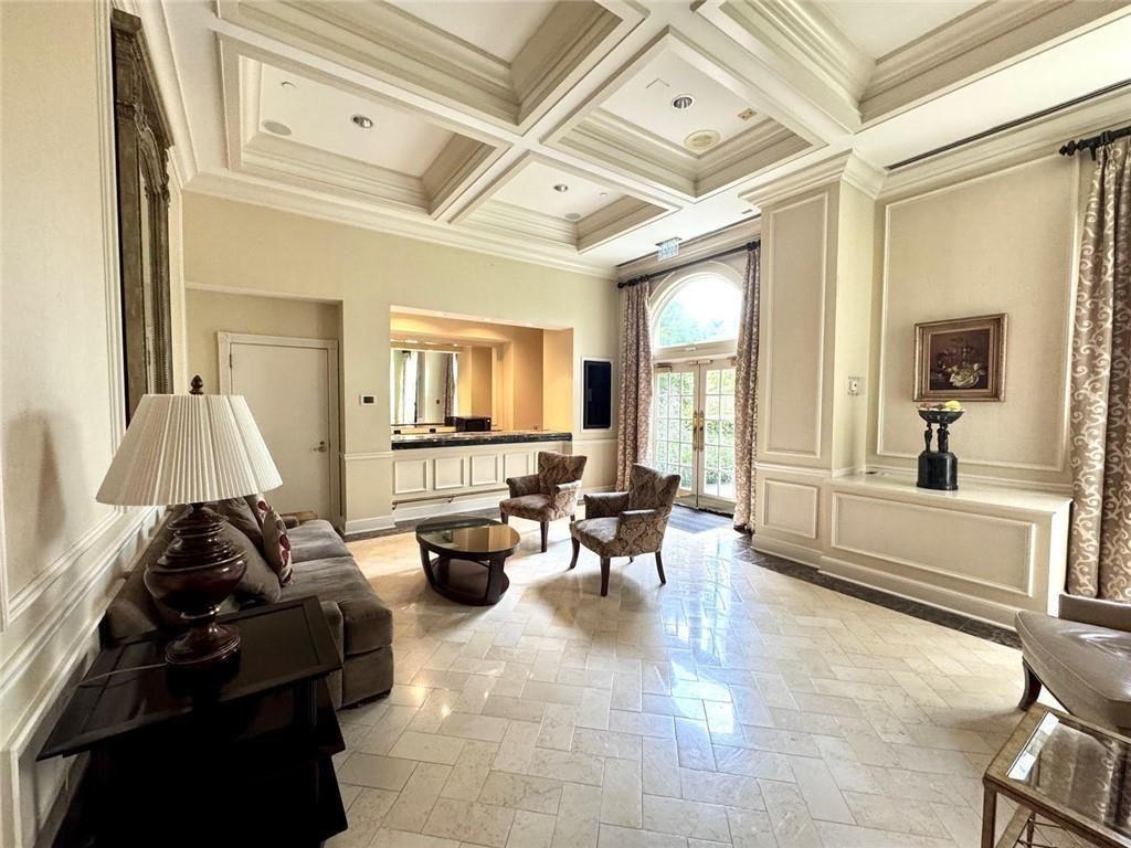 199 14th Street Northeast, Unit 704 Atlanta, GA 30309 - Photo 23 of 34 a living room with furniture and a large window