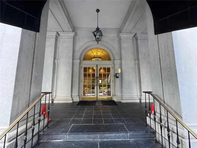 a view of an entryway with wooden floor
