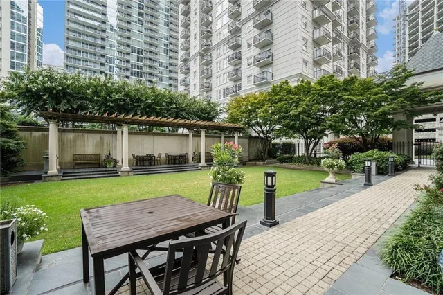a view of a swimming pool with a patio