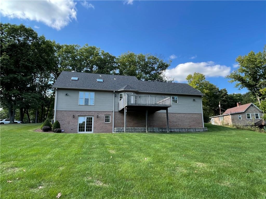 40 Fitzwilliams Road Washington, PA 15301 - Photo 22 of 23 a house that is sitting in the grass with large trees and plants