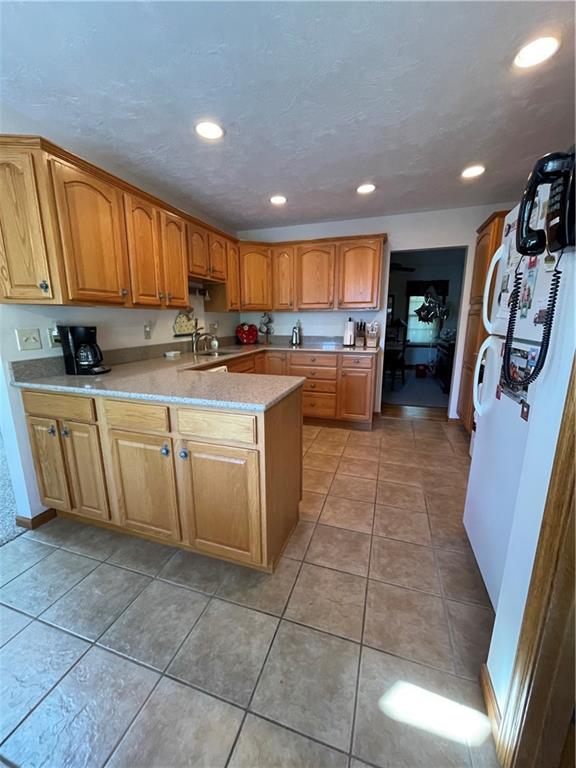 40 Fitzwilliams Road Washington, PA 15301 - Photo 4 of 23 a kitchen with a sink a counter top space appliances and cabinets