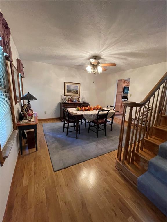 40 Fitzwilliams Road Washington, PA 15301 - Photo 8 of 23 a view of a livingroom with furniture a rug wooden floor and chandelier
