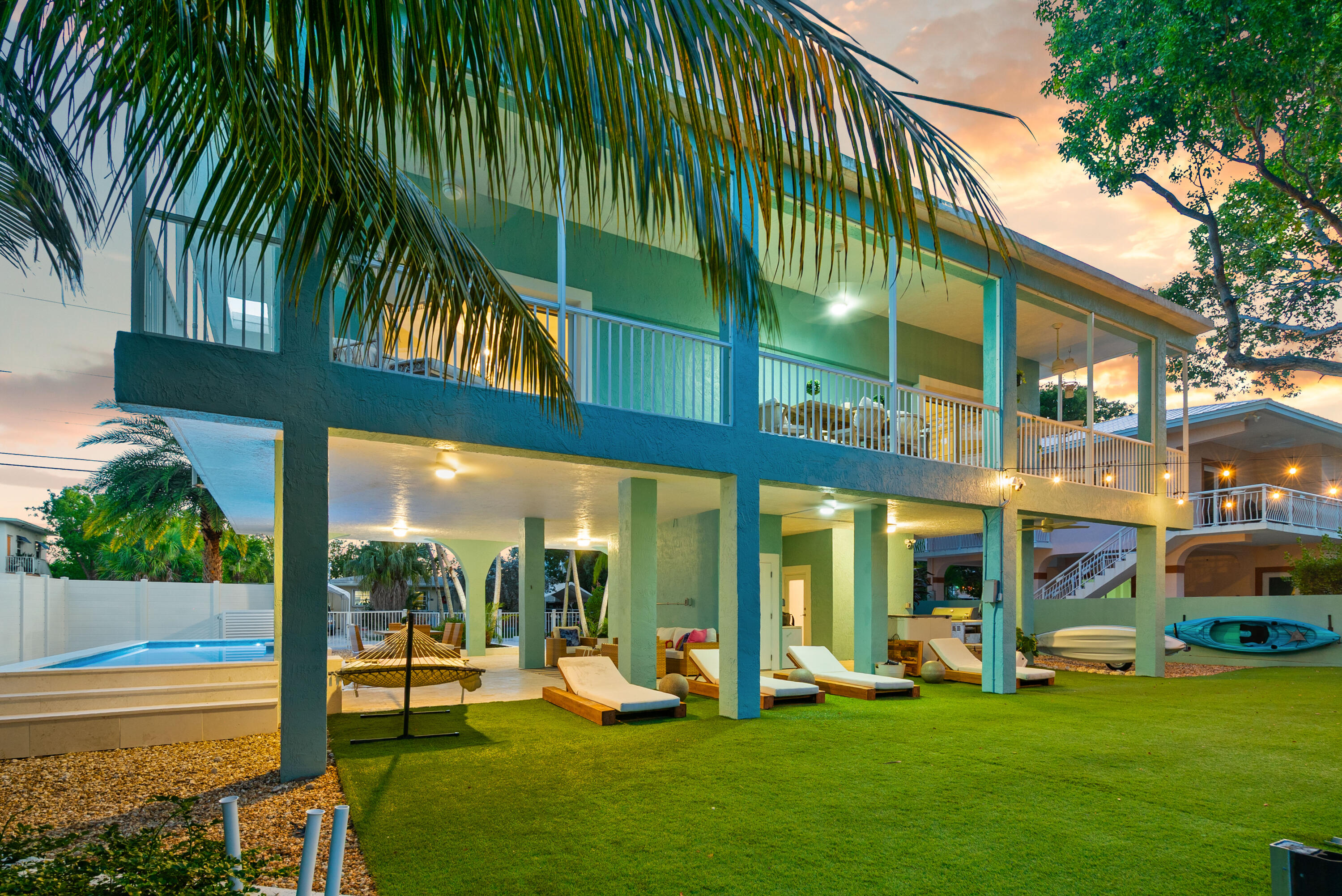 127 Peace Avenue Key Largo, FL 33070 - Photo 1 of 56 a view of a house with a yard patio and swimming pool
