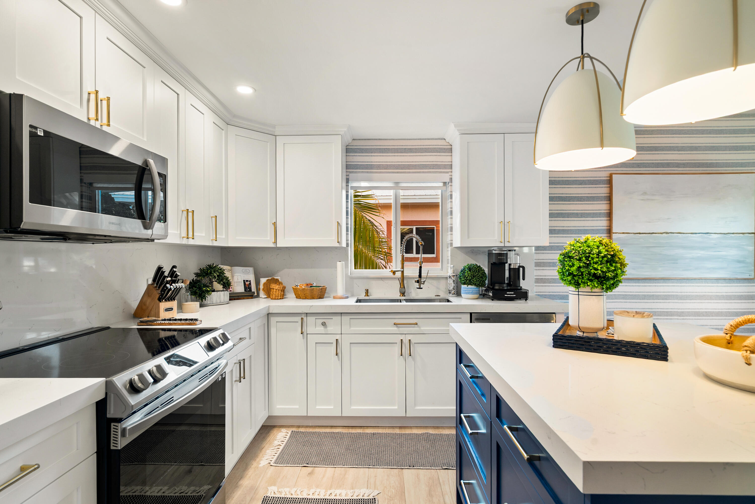 127 Peace Avenue Key Largo, FL 33070 - Photo 45 of 56 a kitchen with a sink a stove and cabinets
