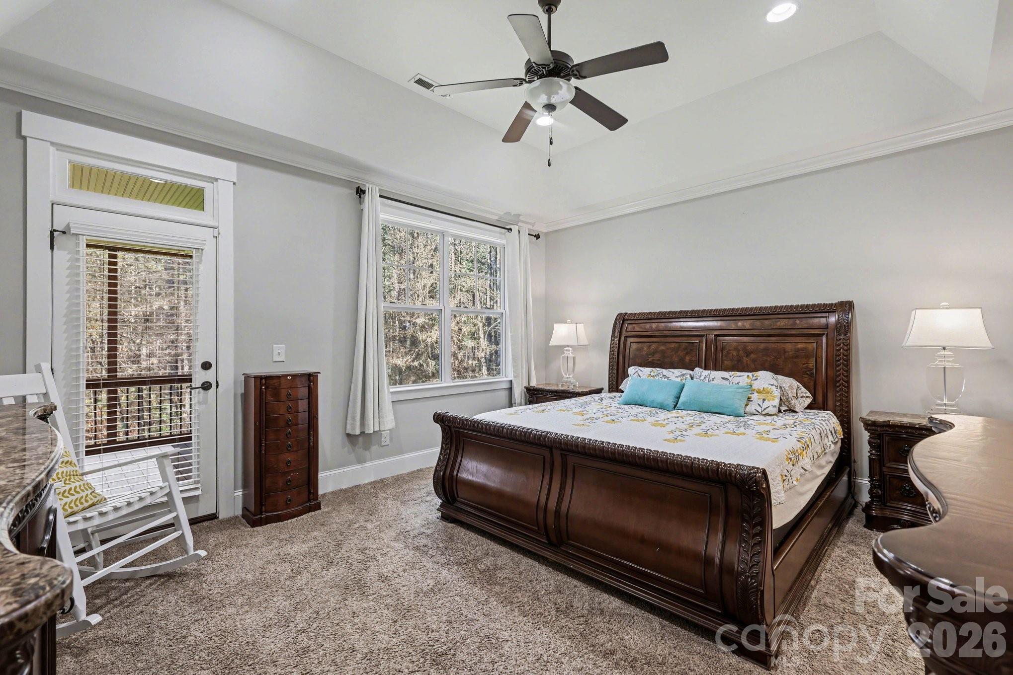 4193 Persimmon Road Lancaster, SC 29720 - Photo 14 of 42 a bedroom with a bed and a chandelier