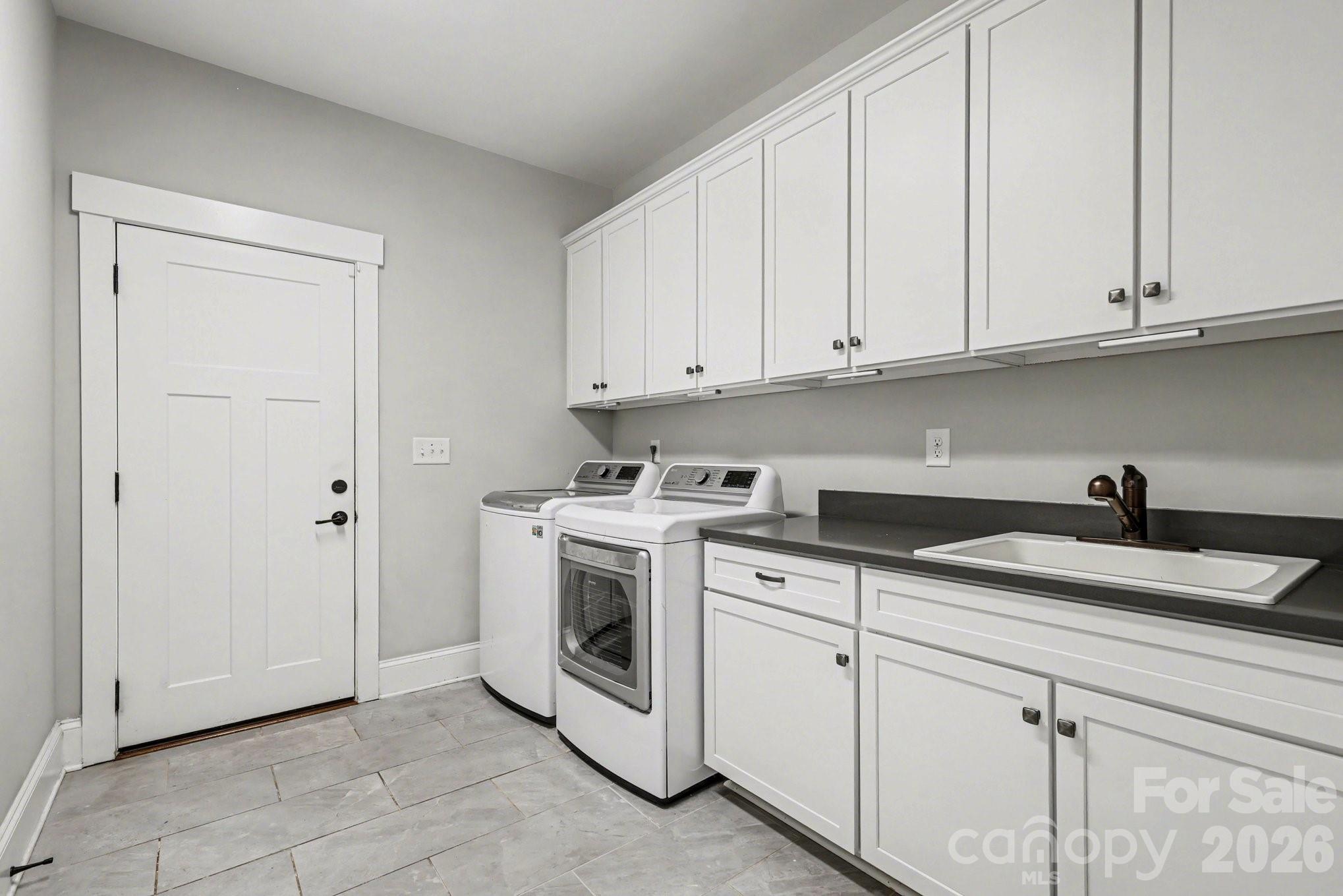 4193 Persimmon Road Lancaster, SC 29720 - Photo 27 of 42 a kitchen with granite countertop white cabinets and white appliances