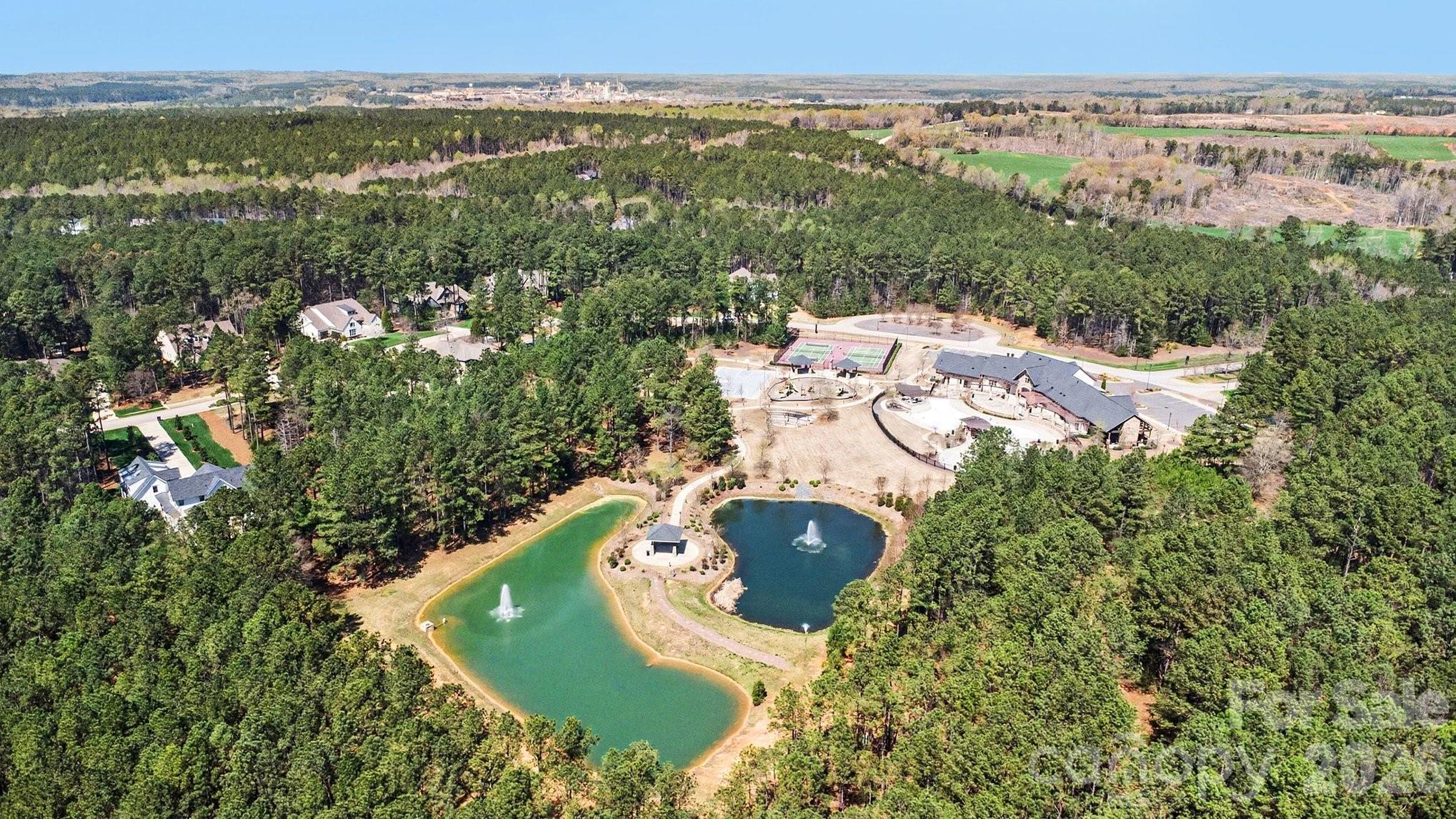4193 Persimmon Road Lancaster, SC 29720 - Photo 38 of 42 an aerial view of a house with a yard and lake view