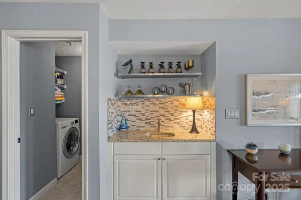 a kitchen with a refrigerator and cabinets