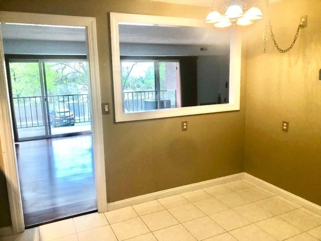 146 Marble Street, Unit 204 Stoneham, MA 02180 - Photo 11 of 21 a view of a room with an empty room
