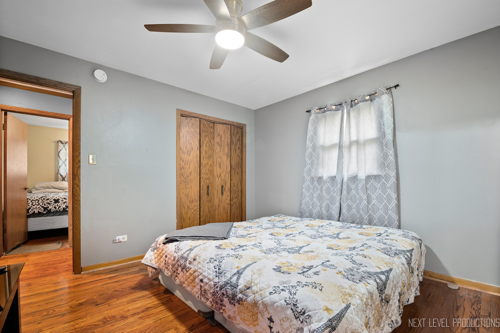 22816 Ridgeway Avenue Richton Park, IL 60471 - Photo 13 of 25 a bedroom with a large bed and a chandelier
