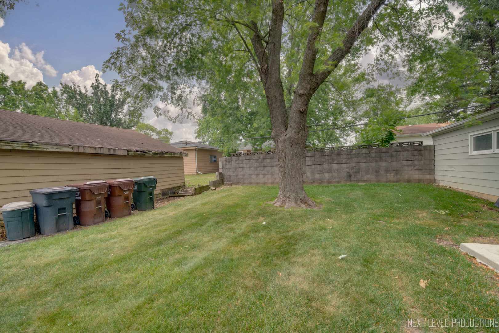 22816 Ridgeway Avenue Richton Park, IL 60471 - Photo 24 of 25 a view of a backyard with table and chairs and wooden fence