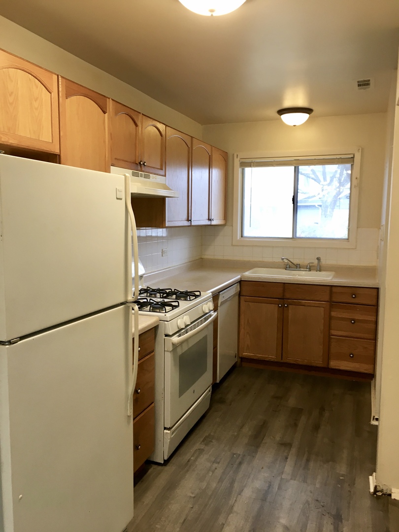 Undisclosed Address Carol Stream, IL 60188 - Photo 2 of 9 a kitchen with stainless steel appliances a stove a sink and a refrigerator