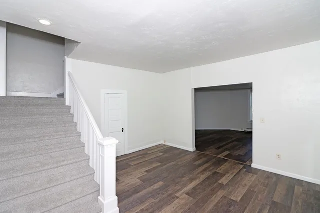 a view of entryway with wooden floor