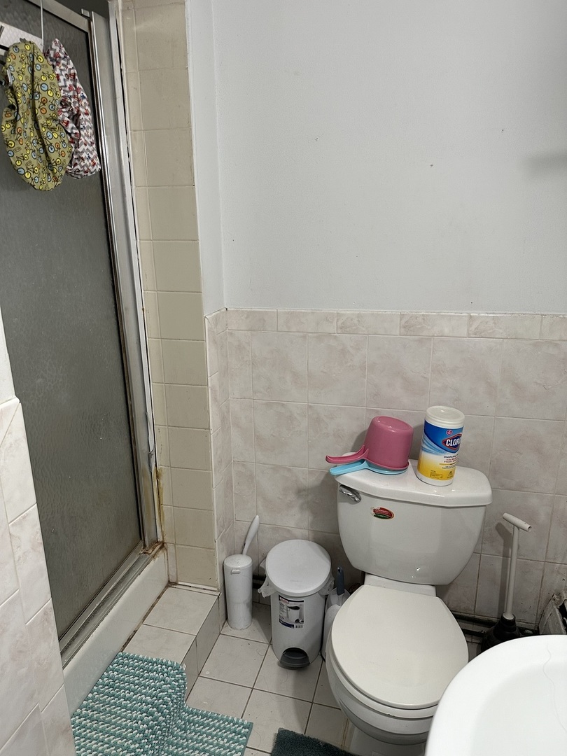 8820 Robin Drive Des Plaines, IL 60016 - Photo 9 of 10 a white toilet sitting next to a bathroom sink