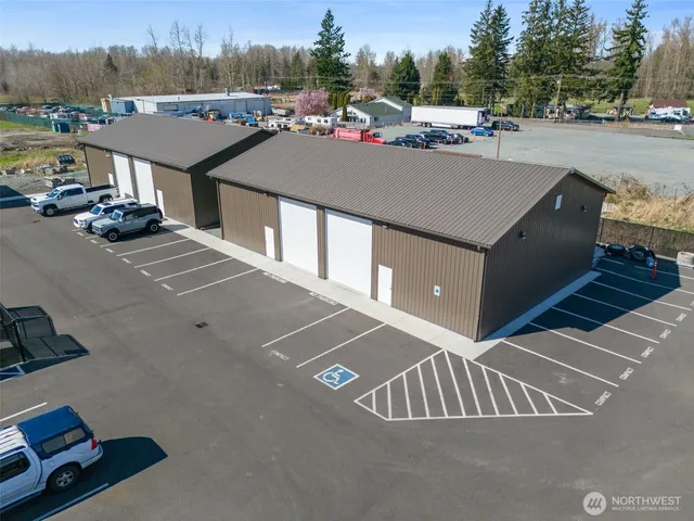 a view of garage with a car parked in it
