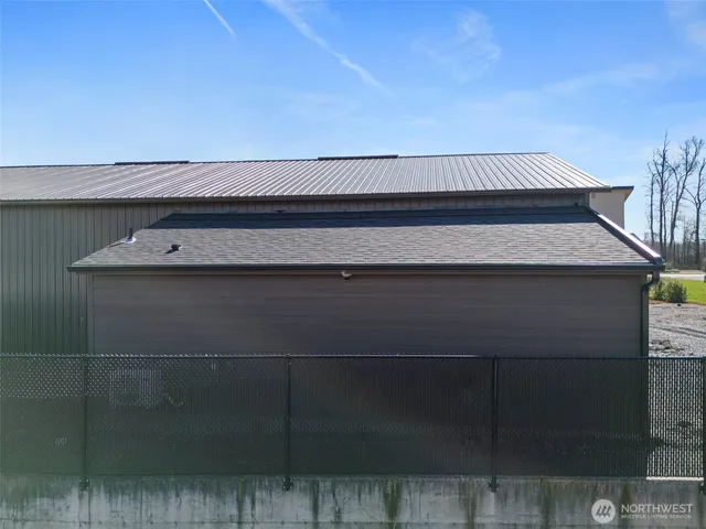an aerial view of a house with a swimming pool