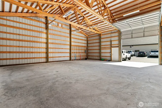 a view of a hallway with paintings on the wall