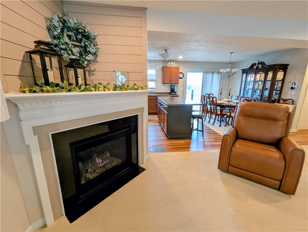 146 Rylie Drive Harmony, PA 16037 - Photo 11 of 43 a living room with furniture and a fireplace