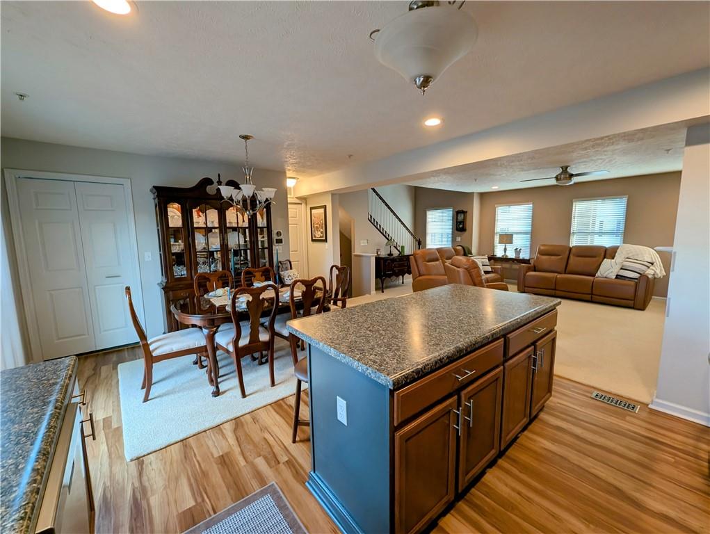 146 Rylie Drive Harmony, PA 16037 - Photo 15 of 43 a living room with furniture a wooden floor and next to a window