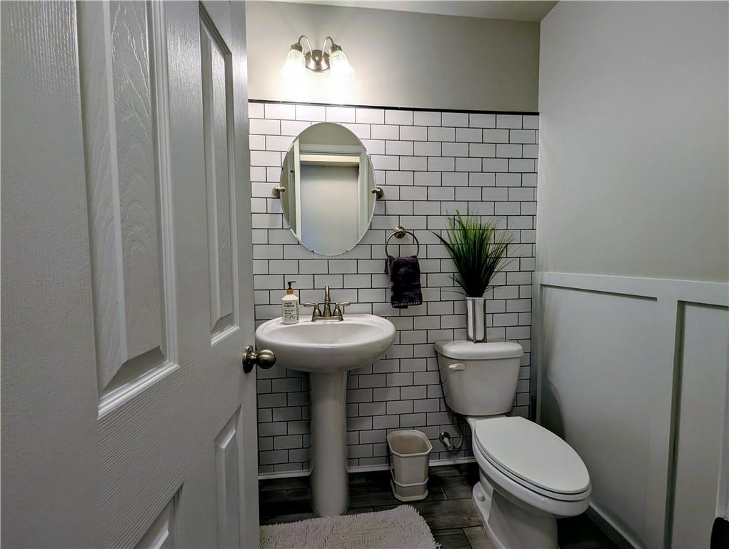 146 Rylie Drive Harmony, PA 16037 - Photo 17 of 43 a bathroom with a toilet sink and mirror